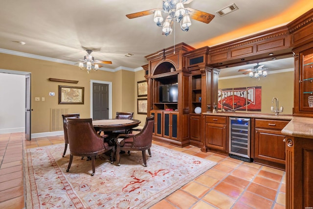 498 Lantern Ter, Hot Springs, AR 71913 - dining area with wine cooler, ceiling fan, light tile patterned flooring, and ornamental molding