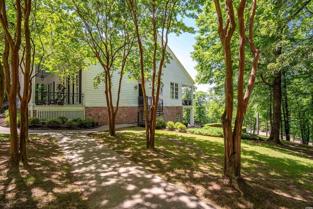 498 Lantern Ter, Hot Springs, AR 71913 - view of side of property featuring brick siding and a lawn