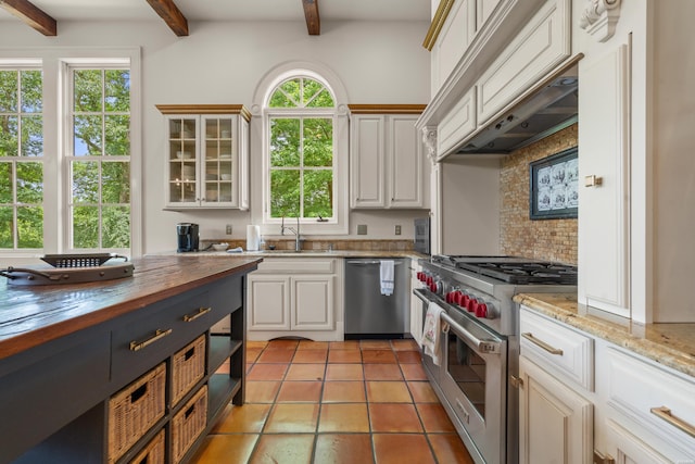 498 Lantern Ter, Hot Springs, AR 71913 - kitchen featuring stainless steel appliances, butcher block countertops, beamed ceiling, decorative backsplash, and light tile patterned floors