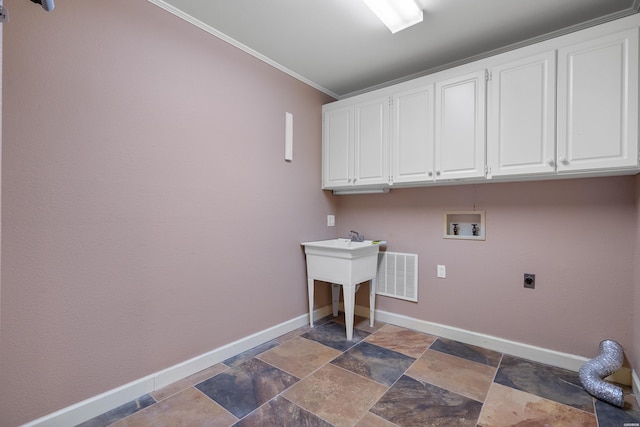 laundry area featuring hookup for a washing machine, hookup for an electric dryer, visible vents, baseboards, and cabinet space