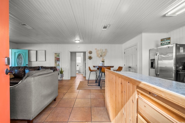 205 Ledgerock Rd, Hot Springs, AR 71913 - kitchen featuring visible vents, stainless steel refrigerator with ice dispenser, open floor plan, light tile patterned flooring, and light countertops