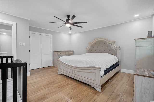 bedroom featuring light wood-style flooring, ornamental molding, baseboards, and recessed lighting