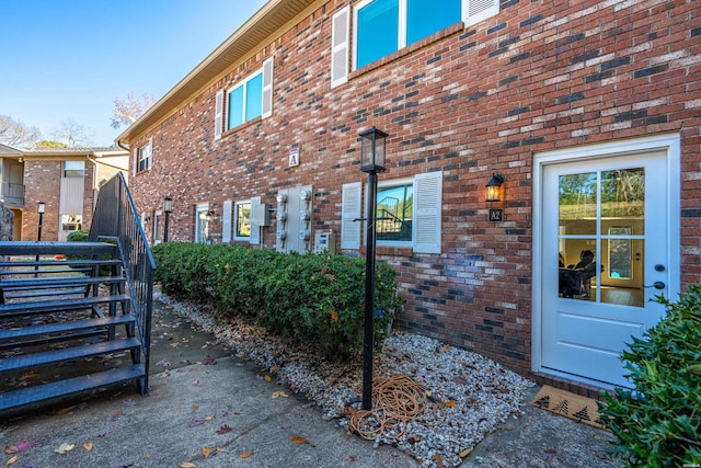 exterior space with brick siding