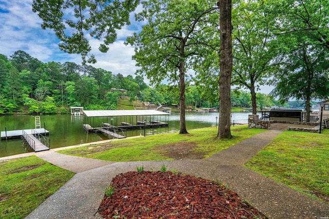 dock area featuring a water view and a yard