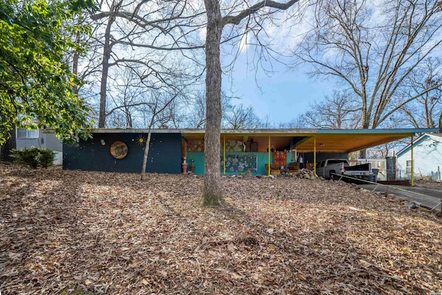 view of front of home featuring a carport