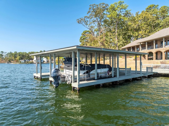 view of dock with a water view and boat lift