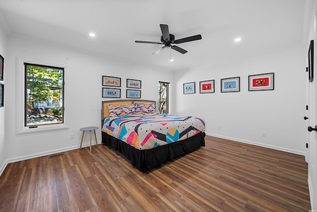 bedroom featuring dark wood-type flooring, recessed lighting, visible vents, and baseboards