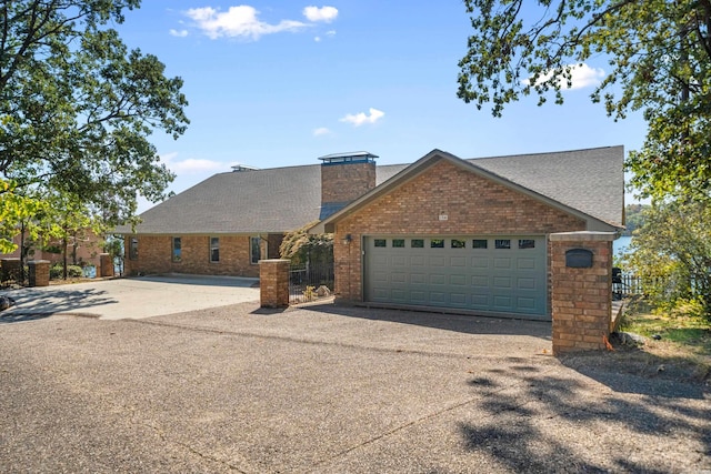 view of front of property with a garage, brick siding, driveway, roof with shingles, and a chimney