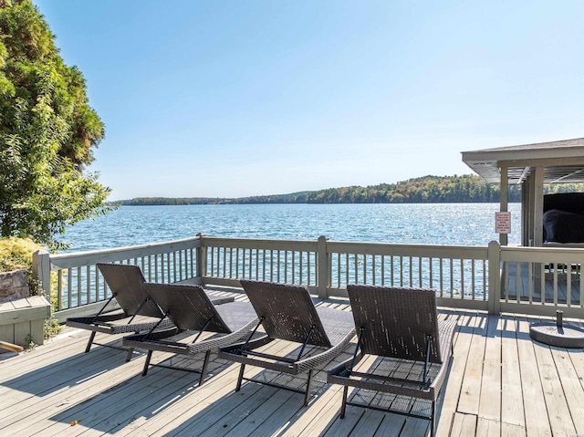 wooden deck with a water view