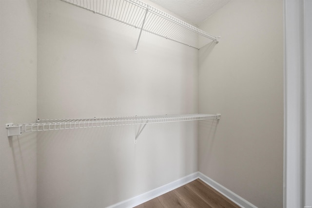 188 Villa Pointe Unit C, Hot Springs, AR 71901 - spacious closet featuring dark wood-style flooring