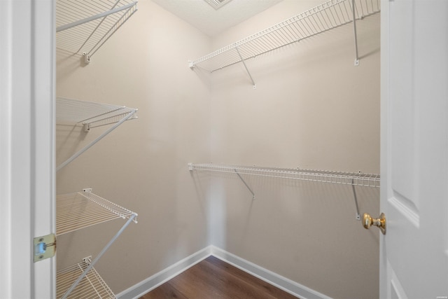 188 Villa Pointe Unit C, Hot Springs, AR 71901 - walk in closet featuring dark wood finished floors