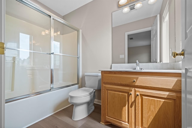 188 Villa Pointe Unit C, Hot Springs, AR 71901 - full bath featuring toilet, wood finished floors, vanity, and shower / bath combination with glass door