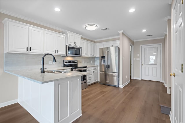 188 Villa Pointe Unit C, Hot Springs, AR 71901 - kitchen featuring stainless steel appliances, a sink, baseboards, tasteful backsplash, and crown molding