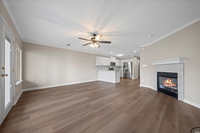 188 Villa Pointe Unit C, Hot Springs, AR 71901 - unfurnished living room featuring crown molding, dark wood-style flooring, ceiling fan, a fireplace, and baseboards