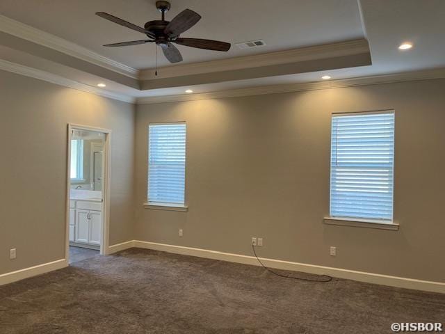131 Coneflower Ct, Hot Springs, AR 71901 - spare room featuring a tray ceiling, ornamental molding, a ceiling fan, baseboards, and dark carpet