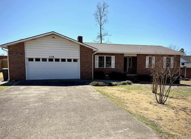 ranch-style house featuring driveway, a shingled roof, a garage, brick siding, and a chimney