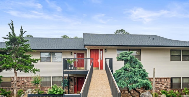 5371 Central Ave Unit 3C, Hot Springs, AR 71913 - view of front of house with a shingled roof and a balcony