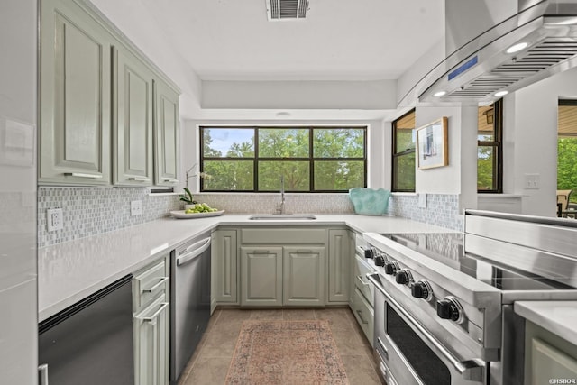 5371 Central Ave Unit 3C, Hot Springs, AR 71913 - kitchen with stainless steel appliances, a sink, wall chimney range hood, decorative backsplash, and light countertops