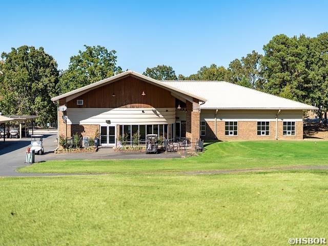 132 Columbia Ct, Hot Springs, AR 71913 - rear view of property featuring a yard and brick siding