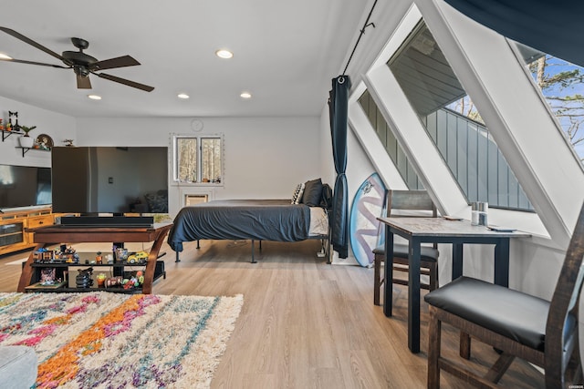 bedroom with recessed lighting and light wood-style flooring