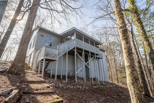 rear view of house featuring stairs