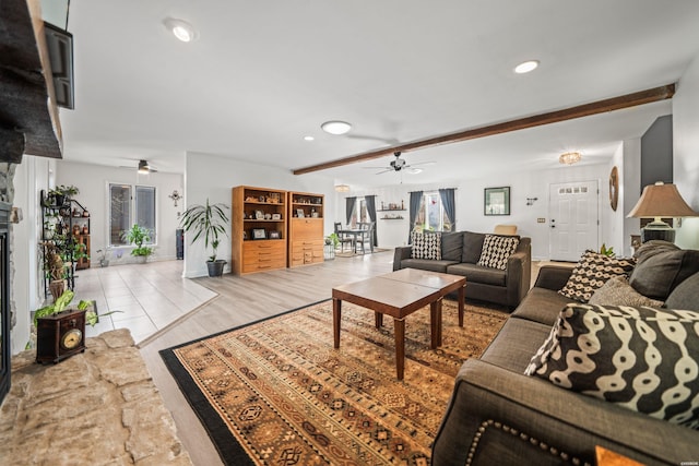 living room with ceiling fan, light wood finished floors, beam ceiling, and recessed lighting