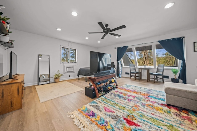 living area featuring recessed lighting, baseboards, a ceiling fan, light wood-style floors, and a wall mounted AC