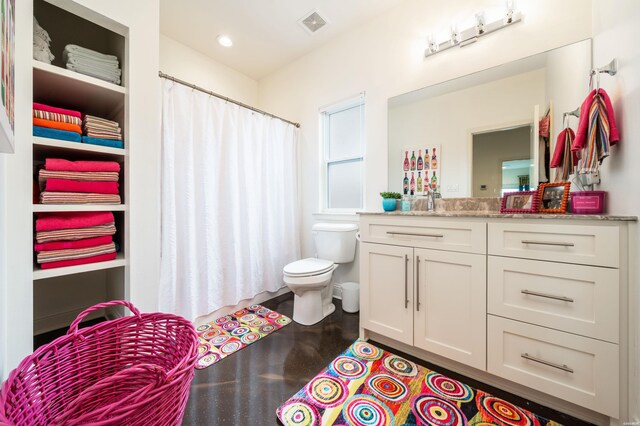 full bathroom with a closet, visible vents, vanity, and toilet