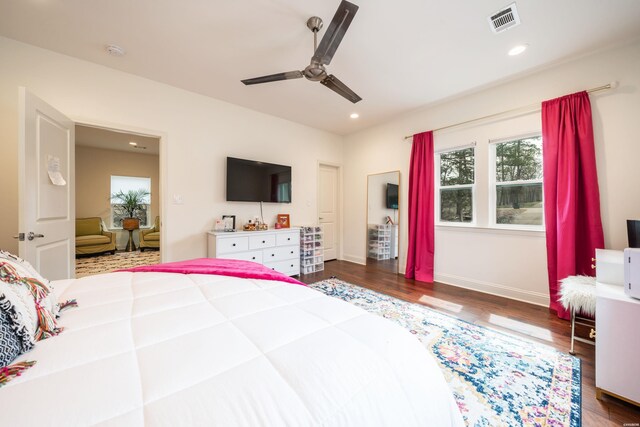 bedroom with a ceiling fan, visible vents, dark wood-type flooring, and recessed lighting