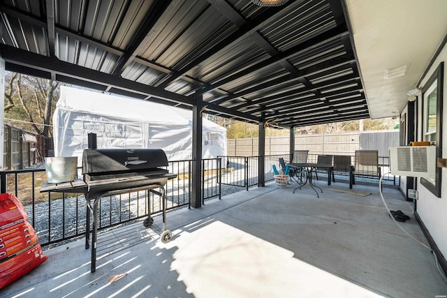 view of patio / terrace featuring a fenced backyard, a grill, and outdoor dining space