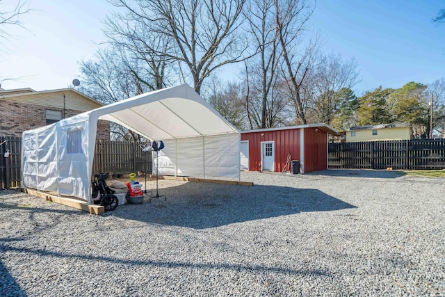 view of shed with fence