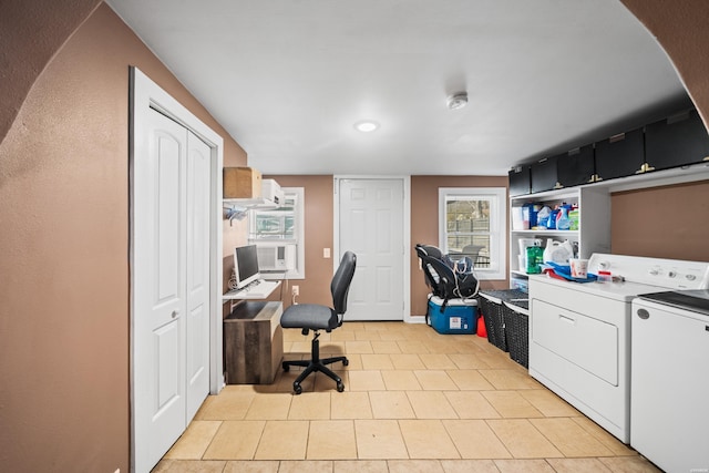 office area with light tile patterned floors and washer and dryer