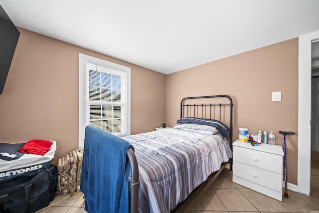 bedroom with light tile patterned flooring