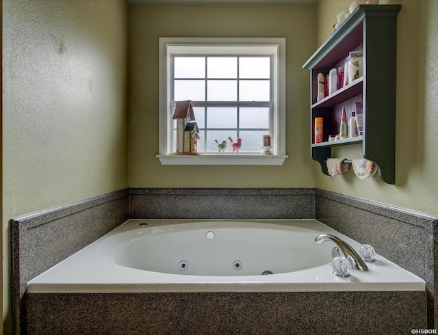 full bathroom featuring a whirlpool tub