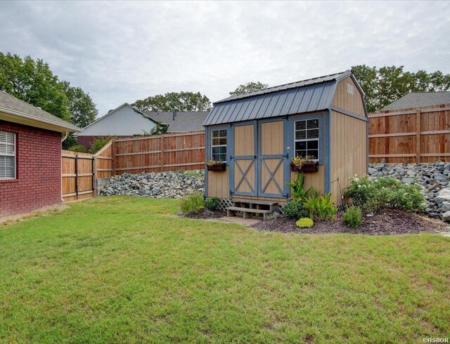 view of shed with a fenced backyard