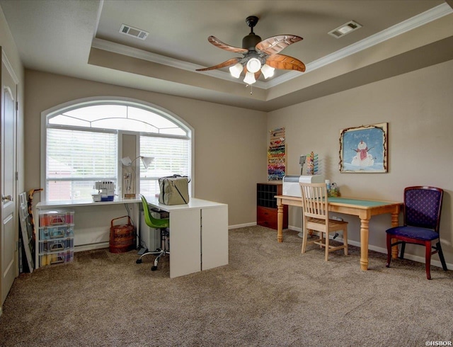 office featuring visible vents, a raised ceiling, and crown molding