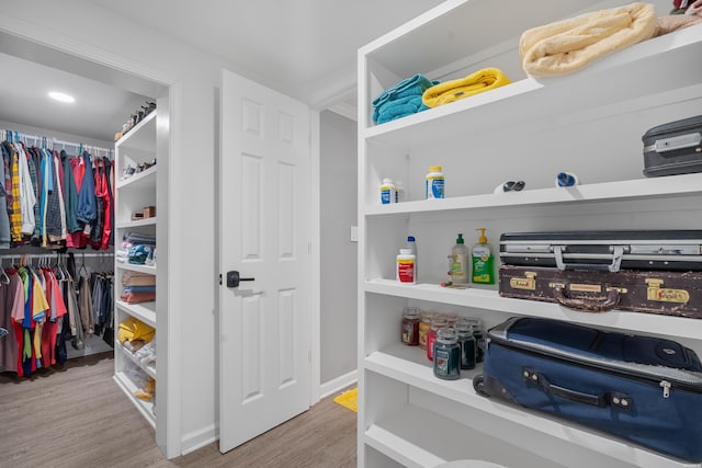 spacious closet featuring light wood-type flooring