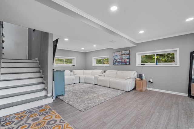 unfurnished living room featuring light wood-style flooring, stairs, ornamental molding, and baseboards