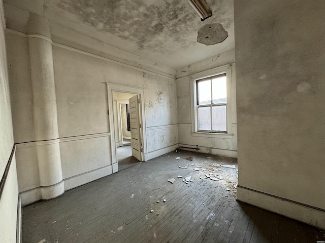 spare room with dark wood-type flooring