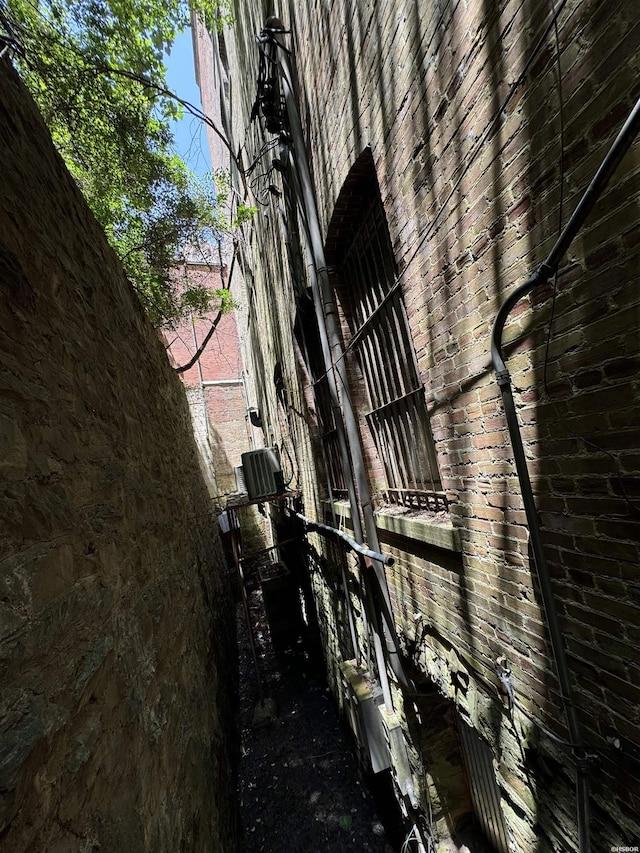 view of property exterior featuring brick siding