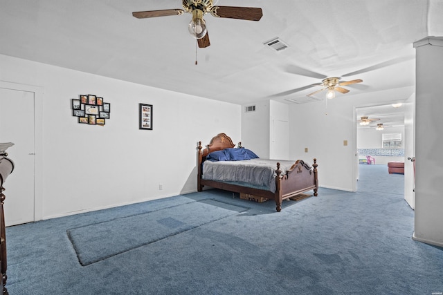 bedroom featuring a ceiling fan, baseboards, visible vents, and carpet flooring