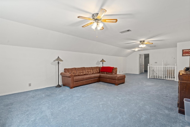 carpeted living area with ceiling fan, visible vents, and vaulted ceiling