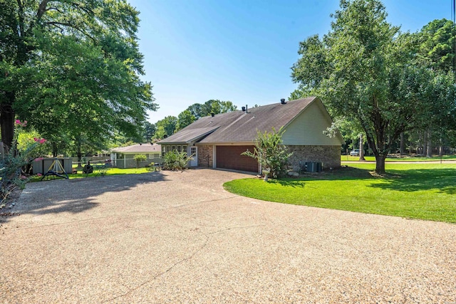 view of home's exterior featuring an attached garage, cooling unit, fence, a yard, and concrete driveway