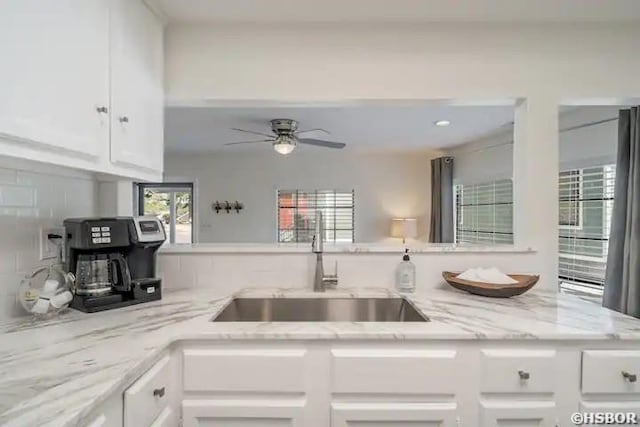 301 Kleinshore Rd Unit 17, Hot Springs, AR 71913 - kitchen with a sink, white cabinets, a ceiling fan, and light stone counters