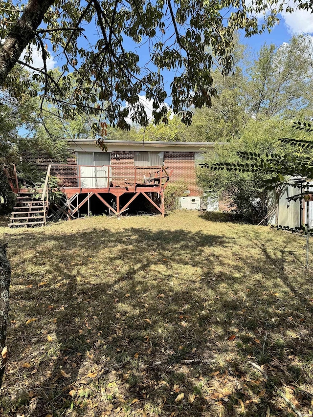 view of yard featuring a wooden deck