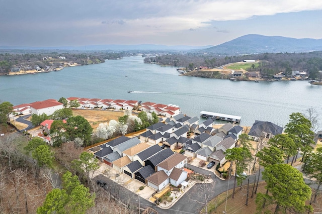 drone / aerial view featuring a residential view and a water and mountain view