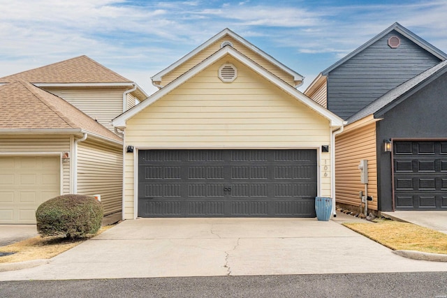 view of front of home featuring an attached garage and driveway