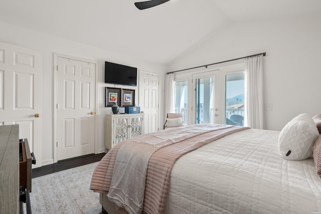 bedroom with a ceiling fan, wood finished floors, access to exterior, vaulted ceiling, and french doors