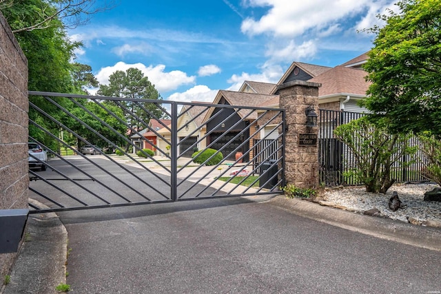 view of gate featuring fence