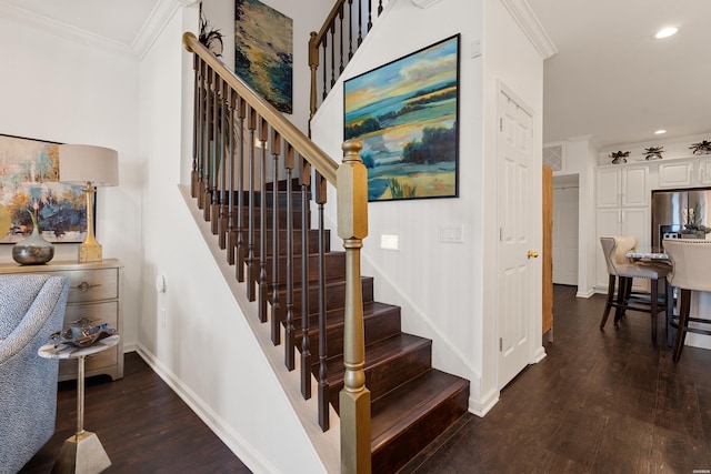 stairs with recessed lighting, wood finished floors, baseboards, and ornamental molding